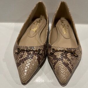 Sam Elelman Snake Skin Taupe and Brown Flats with Goldtone Hatdware across toes.